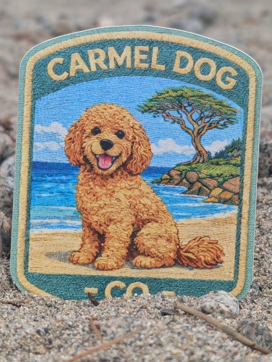Sticker of a Doodle on a beach with 'Carmel Dog Co.' text