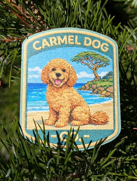 Penny apricot doodle sticker with a beach and cypress tree design, displayed among evergreen branches.